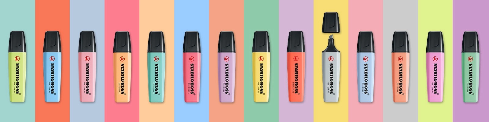 Stabilo Textmarker Verschiedene bunte Textmarker auf einem bunt gestreiften Hintergrund